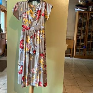Angie girls floral romper dress. Size Medium.